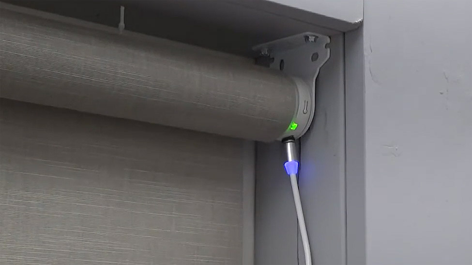Motorized roller shade charging