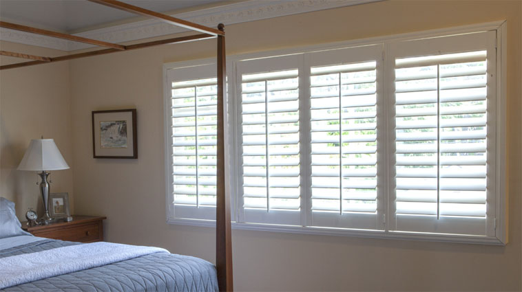 Faux Wood Shutters in a Bedroom