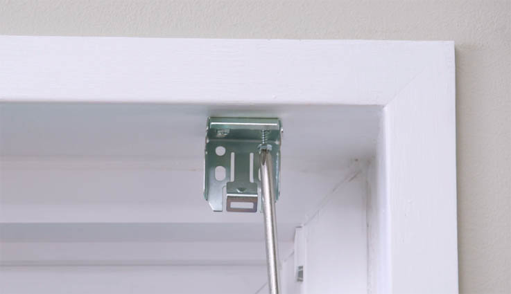 Unscrewing window treatment bracket