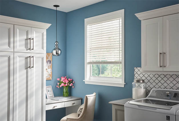 Horizontal faux wood blind in laundry room