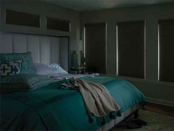 Blackout roller shades in a bedroom