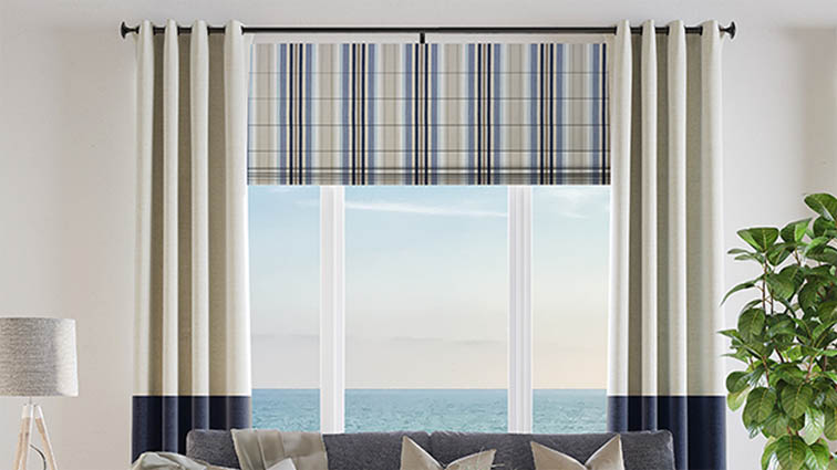 Roman shades layered with curtains