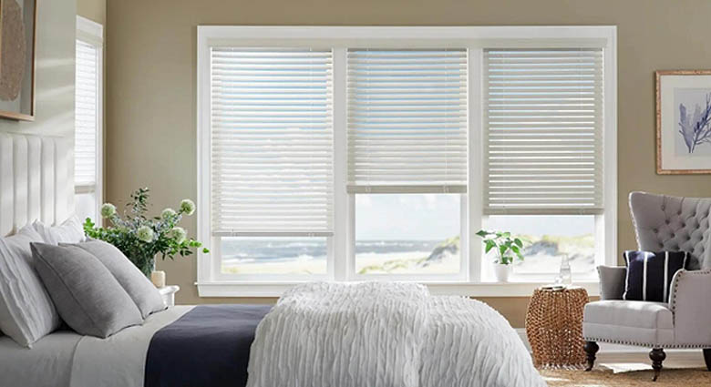 Custom faux wood blinds in a bedroom