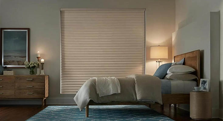 Blackout window shade in a bedroom