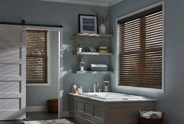 Faux wood blinds next to a bathtub