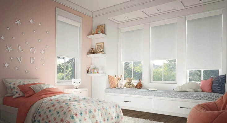 White roller shades in a kids room